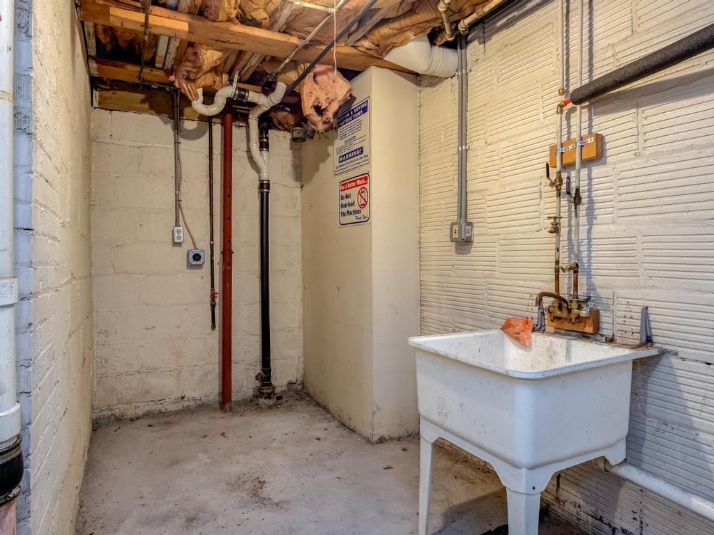 282 9th Street Ambridge, PA 15003 - Photo 21 of 21 a bathroom with a sink and a mirror