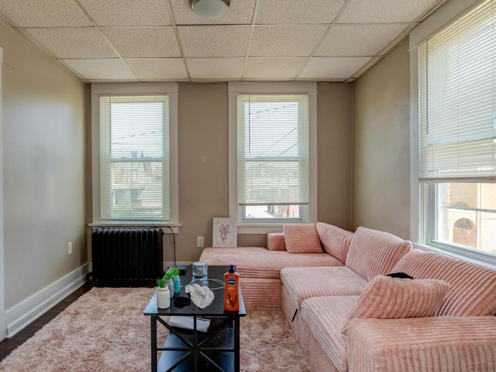 282 9th Street Ambridge, PA 15003 - Photo 6 of 21 a living room with a couch and a window