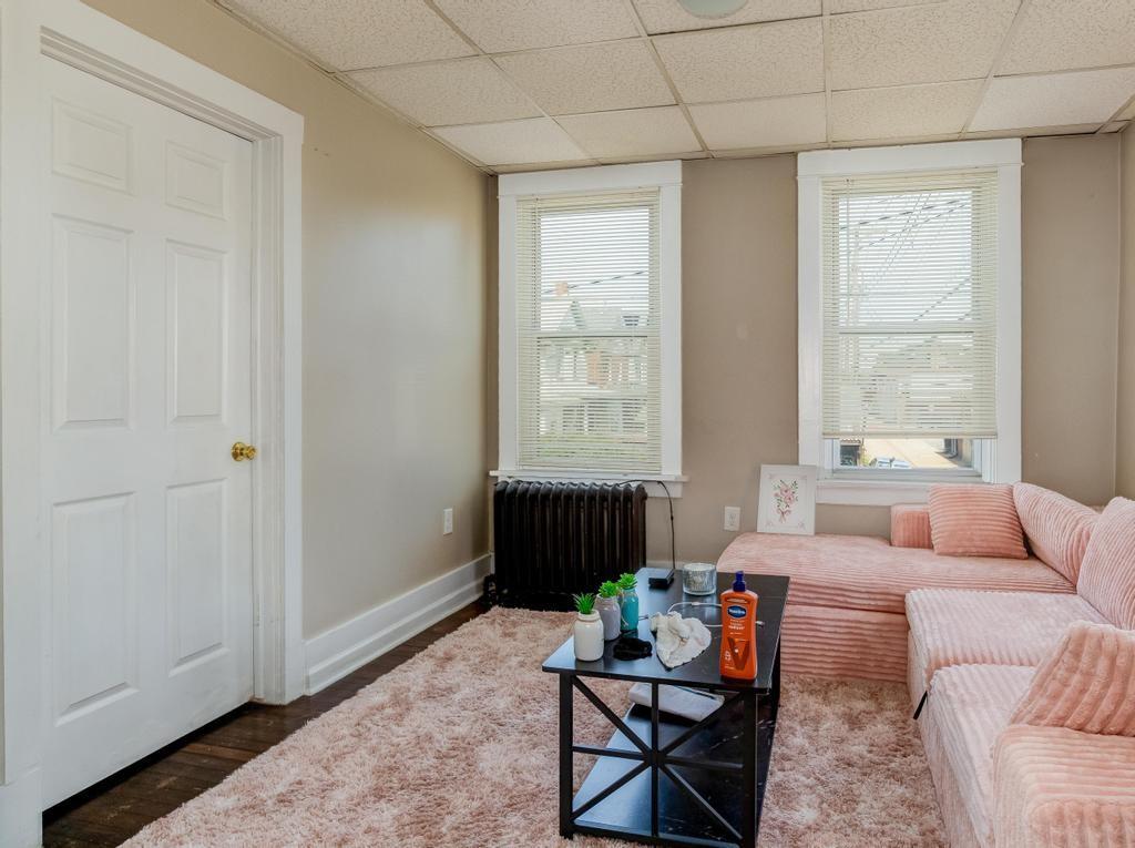 282 9th Street Ambridge, PA 15003 - Photo 8 of 21 a living room with furniture and a window
