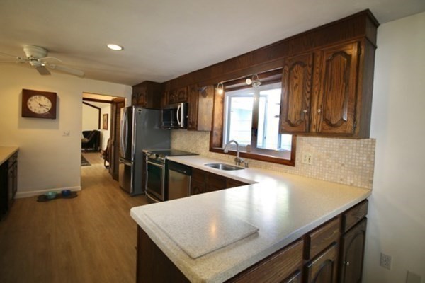 16 Wentworth Road Canton, MA 02021 - Photo 4 of 26 a kitchen with counter top space and sink