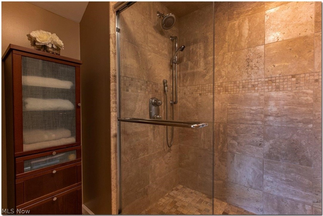 4660 Liberty Road South Euclid, OH 44121 - Photo 24 of 35 Updated Full Bathroom #2
with Separate Room with Glass Enclosed Shower with Porcelain Tiles
and Stone Mosaic Accents