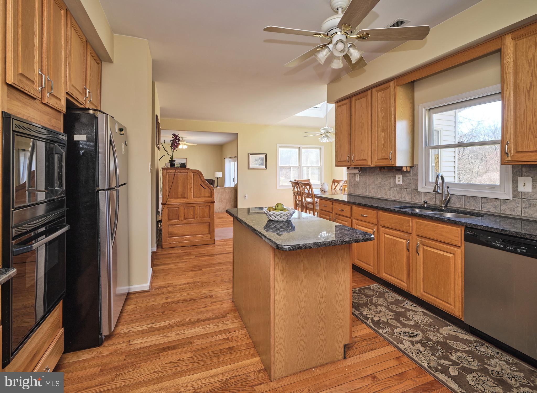 38 Bittersweet Drive Doylestown, PA 18901 - Photo 11 of 36 a kitchen with stainless steel appliances granite countertop a sink stove and refrigerator