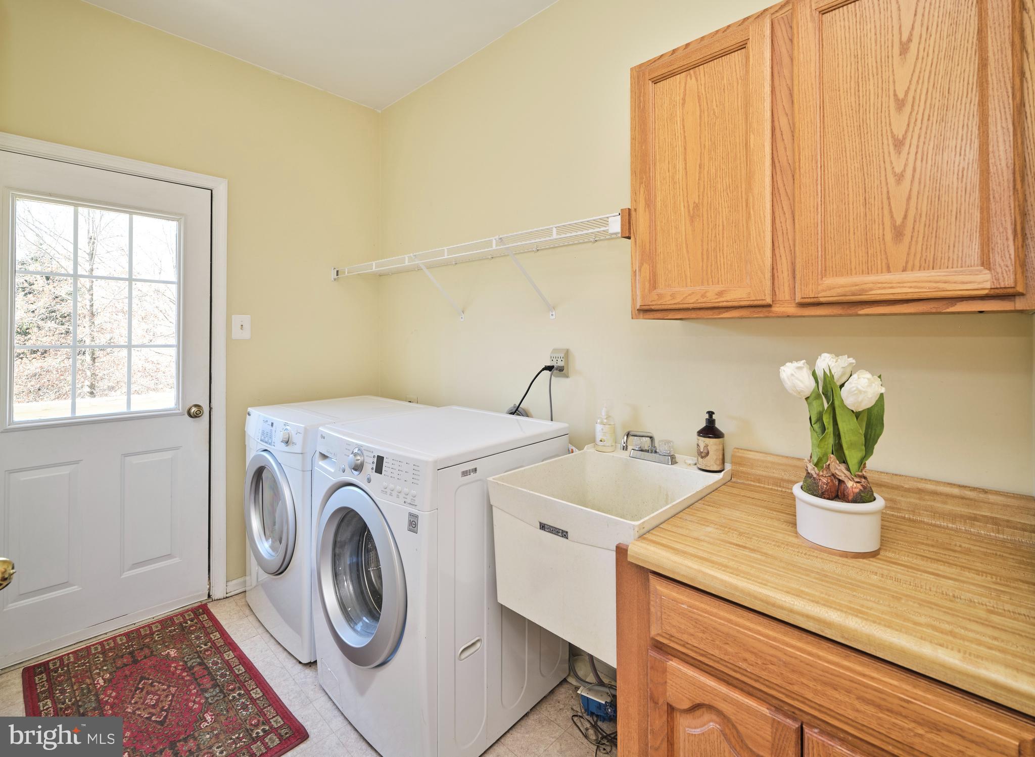 38 Bittersweet Drive Doylestown, PA 18901 - Photo 18 of 36 a view of a storage and utility room with washer and dryer