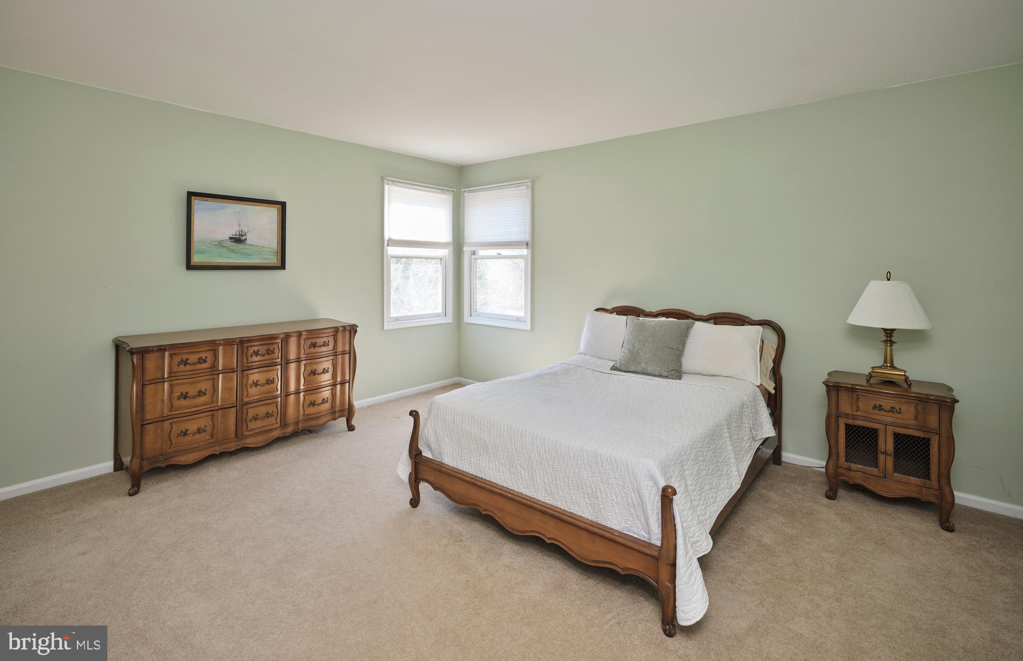 38 Bittersweet Drive Doylestown, PA 18901 - Photo 28 of 36 a spacious bedroom with a bed chair and a window