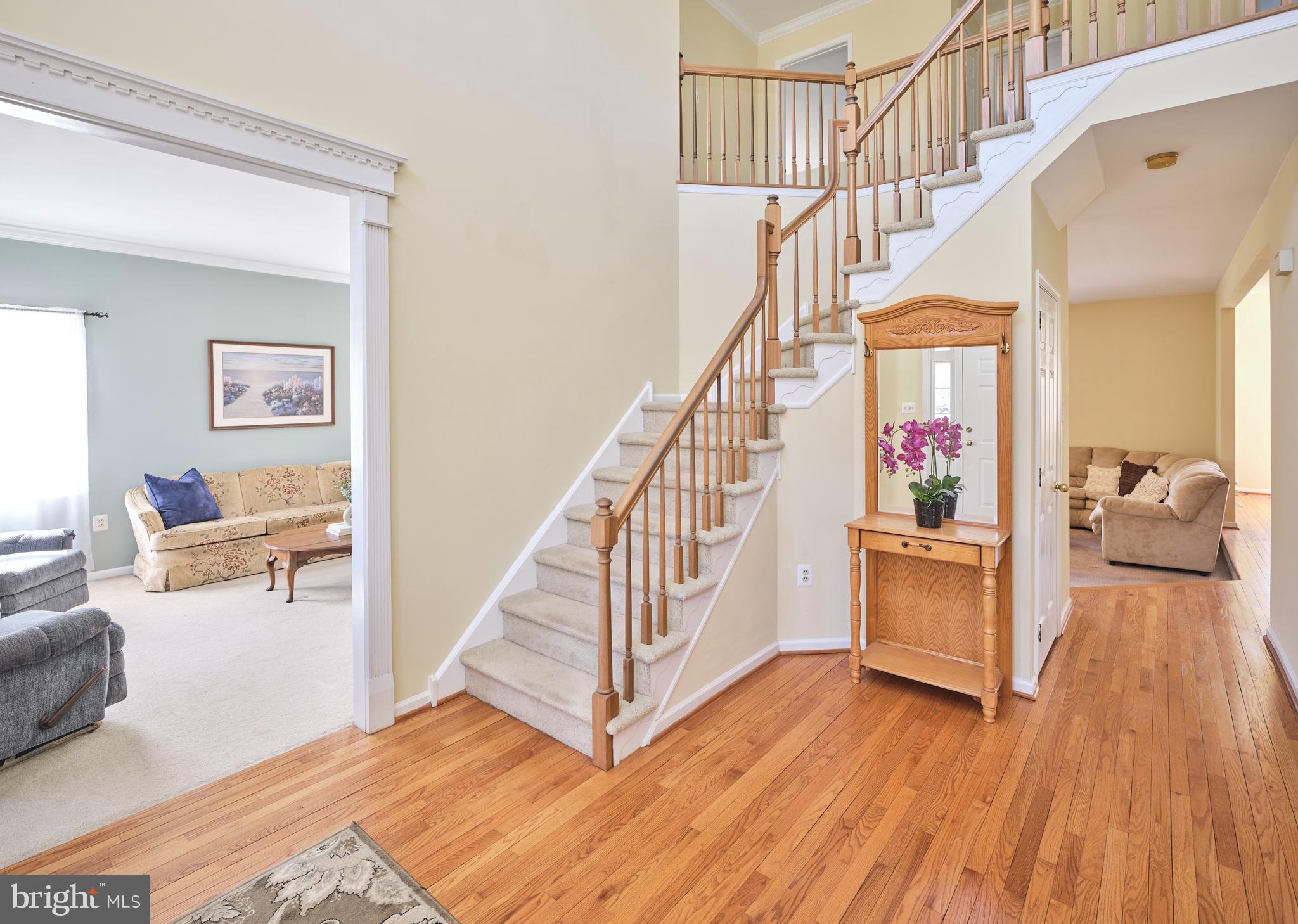 38 Bittersweet Drive Doylestown, PA 18901 - Photo 4 of 36 a view of staircase and living room with wooden floor