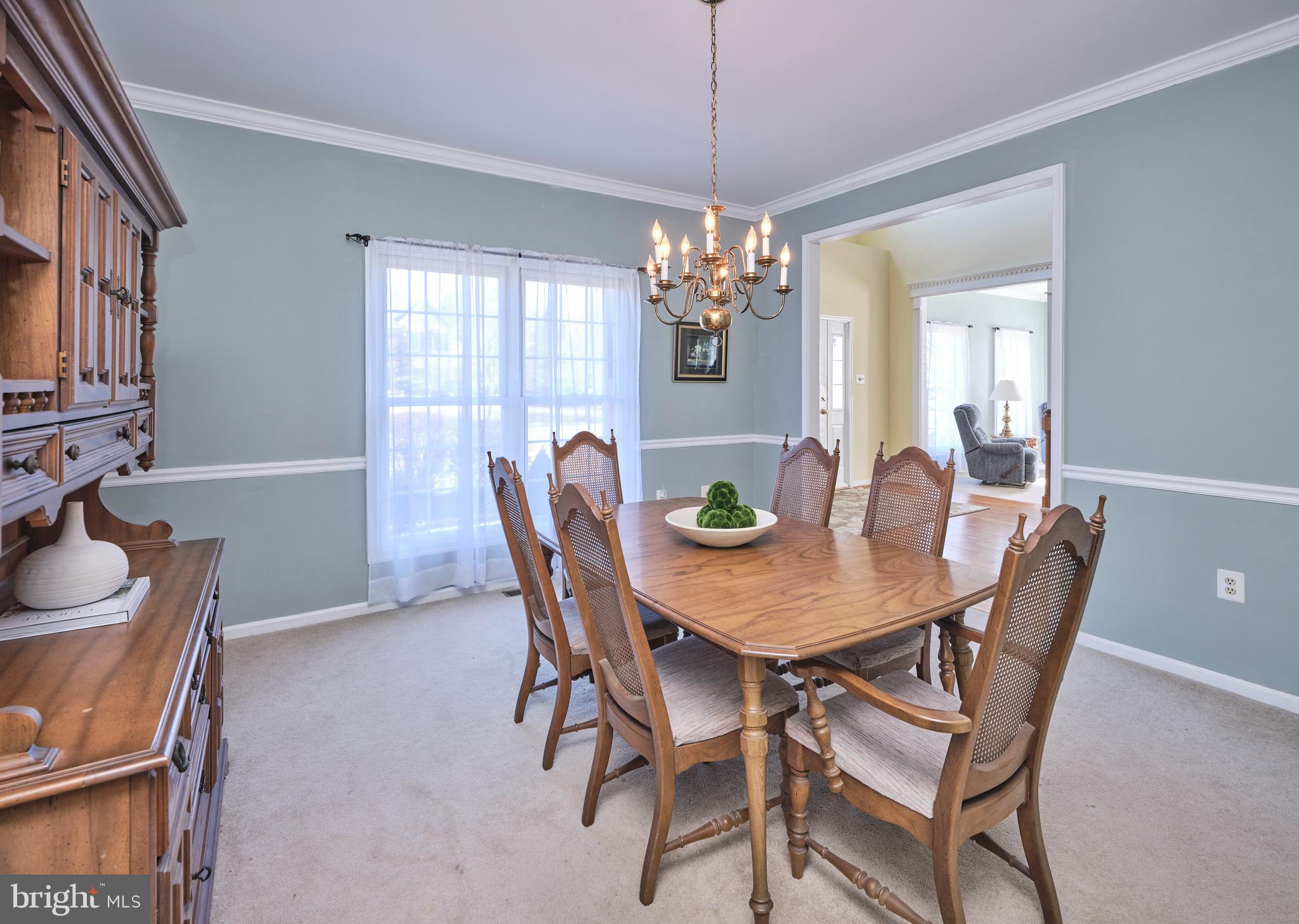 38 Bittersweet Drive Doylestown, PA 18901 - Photo 8 of 36 a view of a dining room with furniture a chandelier and wooden floor