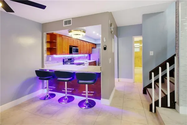 a very nice looking bedroom with a bed and a ceiling fan
