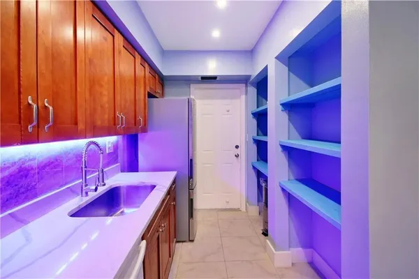 a kitchen that has a stove and a microwave