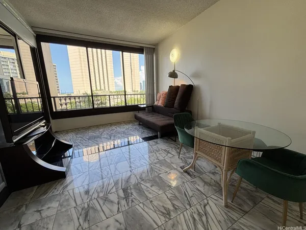 a living room with furniture and a window