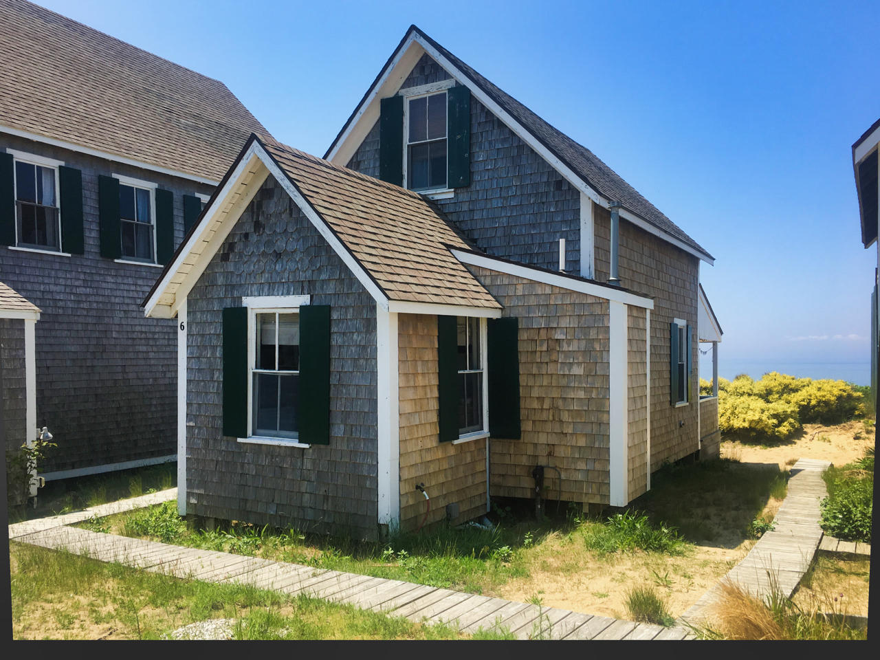 62 Corn Hill Road, Unit 6 Truro, MA 02666 - Photo 17 of 19 a view of a house with yard