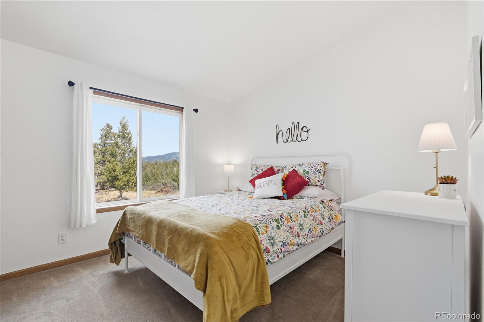 1146 Tapadero Road Bailey, CO 80421 - Photo 14 of 28 a bedroom with a bed and a window