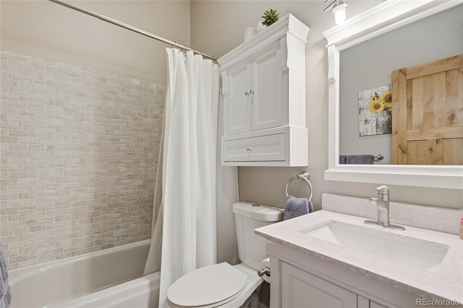 1146 Tapadero Road Bailey, CO 80421 - Photo 16 of 28 a bathroom with a sink toilet and shower