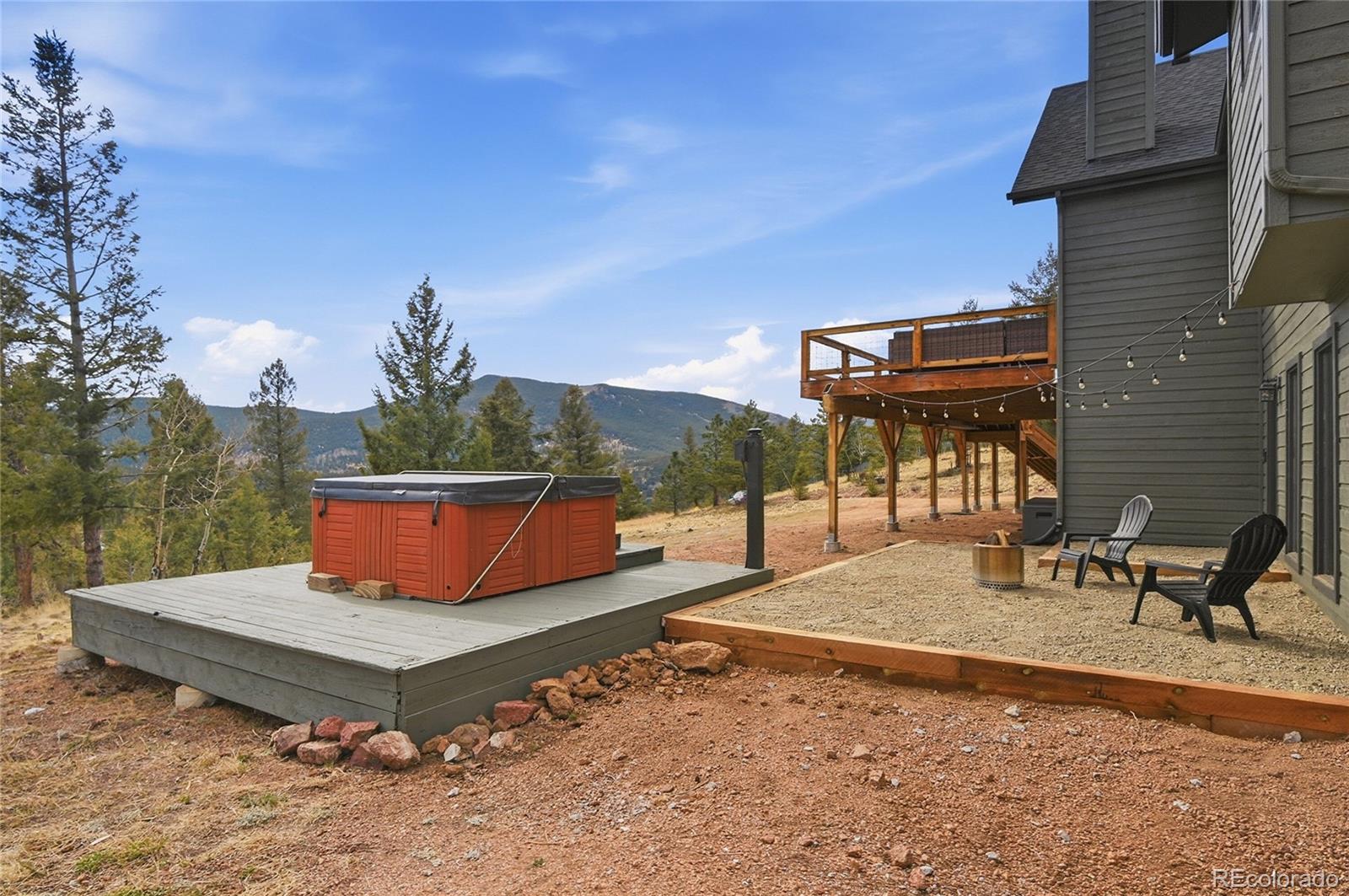 1146 Tapadero Road Bailey, CO 80421 - Photo 23 of 28 a view of a backyard with sitting area
