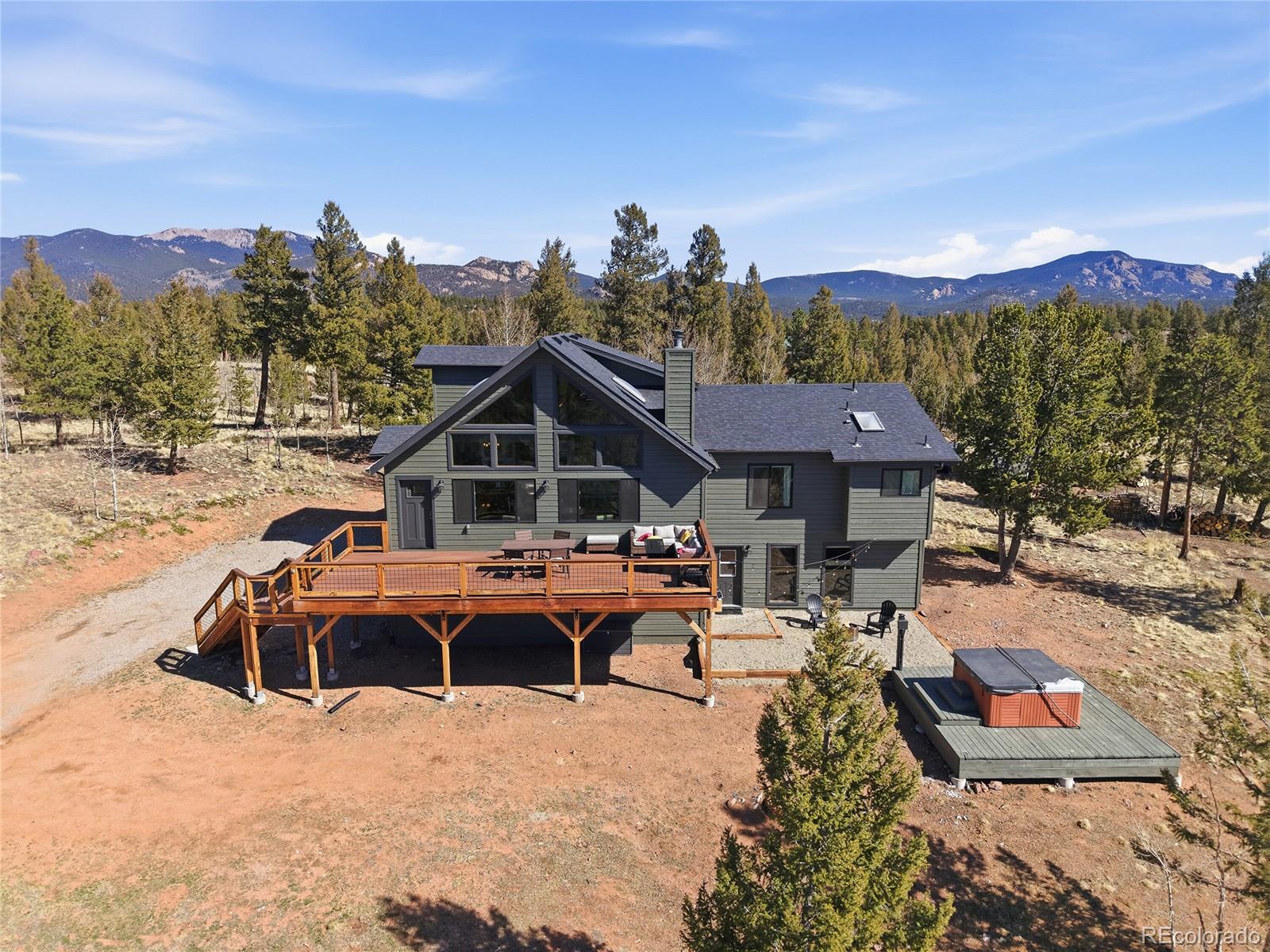 1146 Tapadero Road Bailey, CO 80421 - Photo 28 of 28 a view of a house with a yard