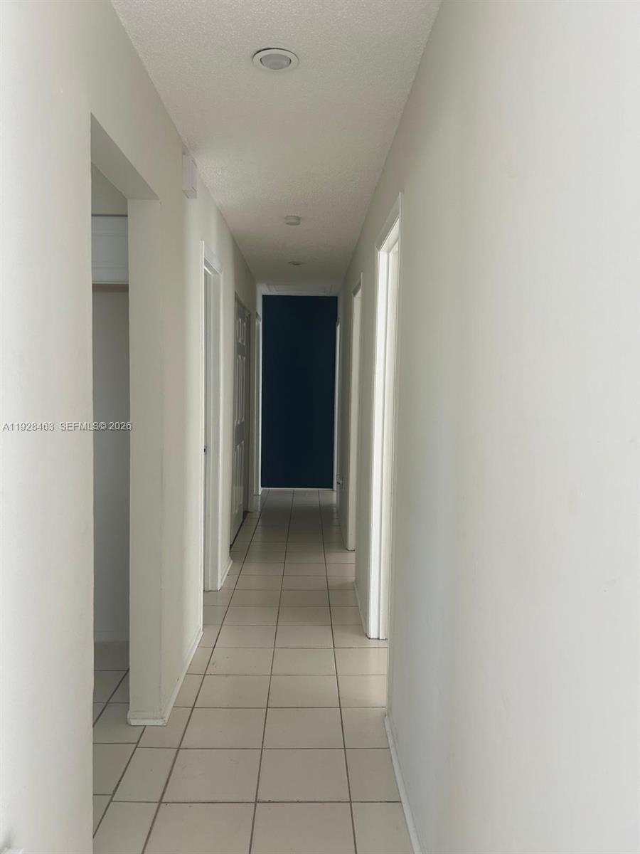 1599 Northeast Cindy Circle, Unit A Palm Bay, FL 32905 - Photo 9 of 13 a view of an empty room and window