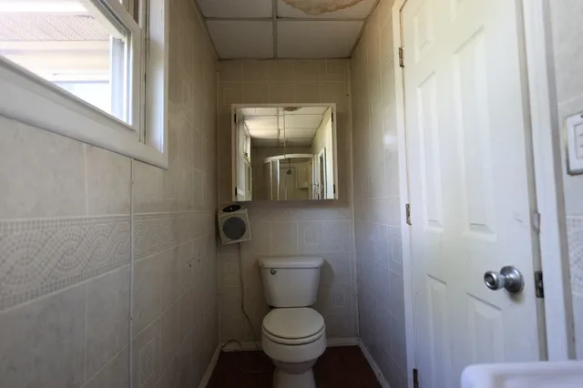 a bathroom with a toilet and a sink