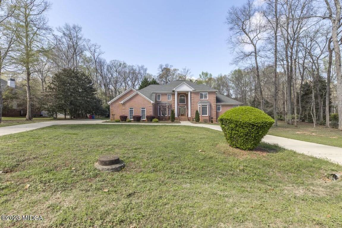 100 Balkcom Place Macon, GA 31210 - Photo 3 of 75 a view of a house with a yard