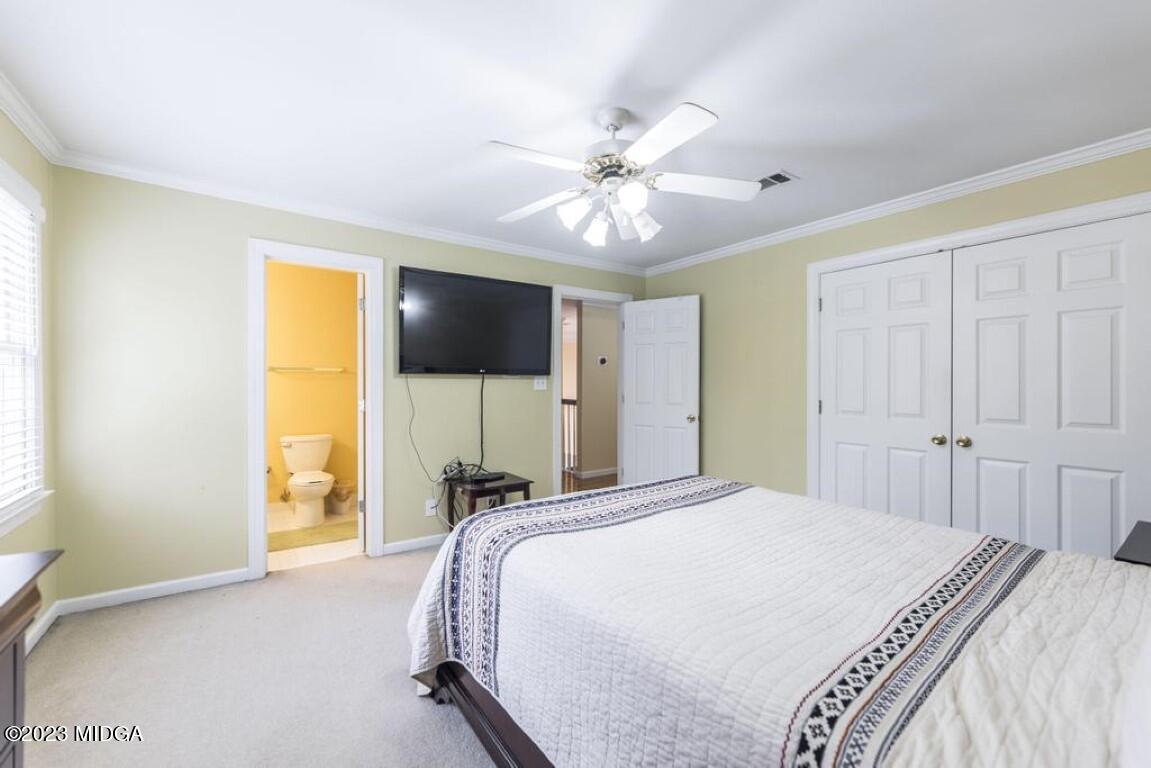 100 Balkcom Place Macon, GA 31210 - Photo 54 of 75 a bedroom with a bed window and a flat screen tv