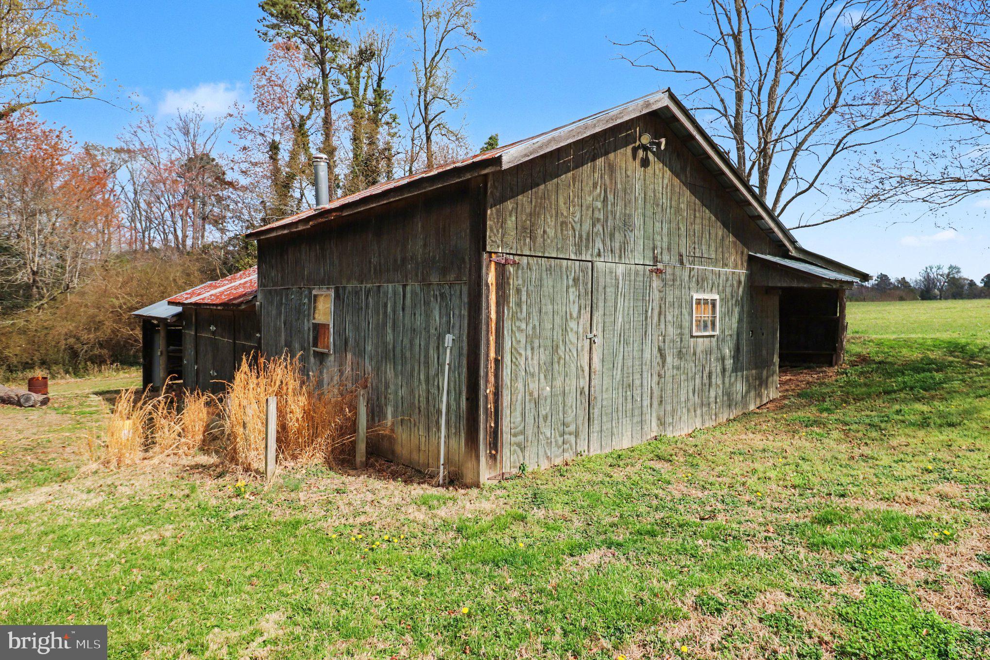 306 Jones Creek Road Warsaw, VA 22572 - Photo 33 of 40 Barn, workshop, garage, lean to & woodshed