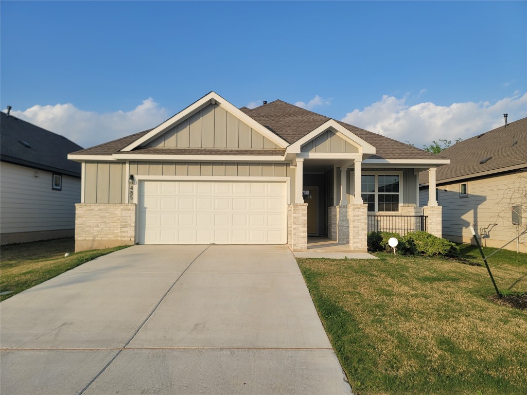 a front view of a house with yard
