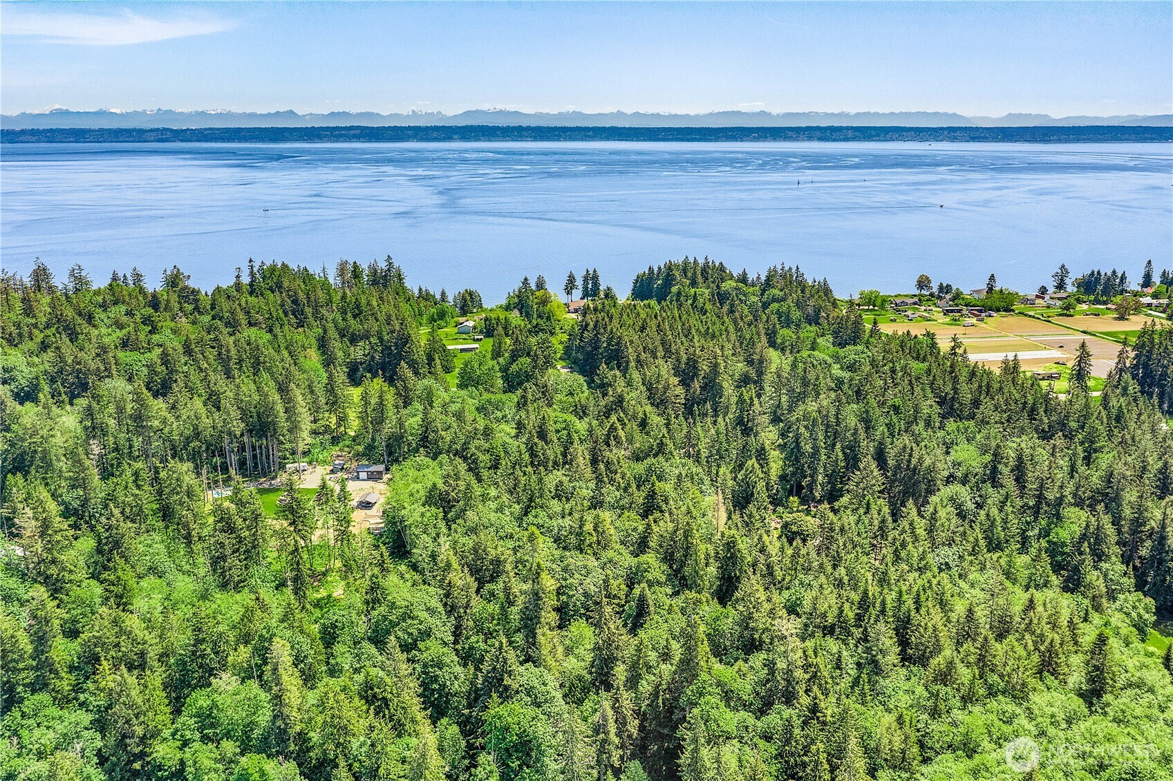 0 Pilot Point Road Northeast Kingston, WA 98346 - Photo 16 of 21 a view of a lake with a garden