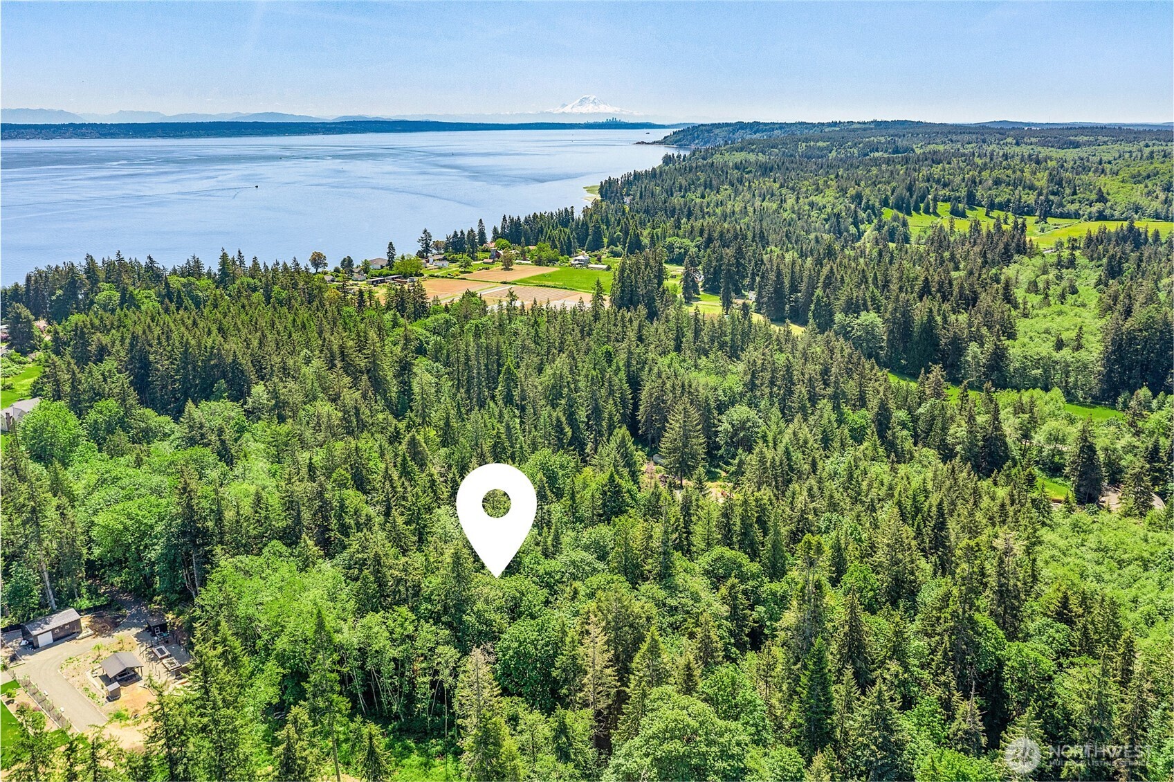 0 Pilot Point Road Northeast Kingston, WA 98346 - Photo 5 of 21 a view of a back yard of a house with a lake view