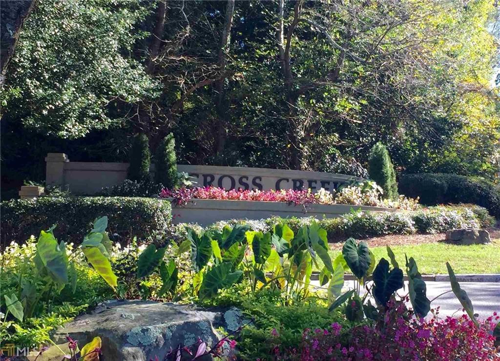 132 Lablanc Way Northwest Atlanta, GA 30327 - Photo 1 of 1 a street with lots of flowers and trees