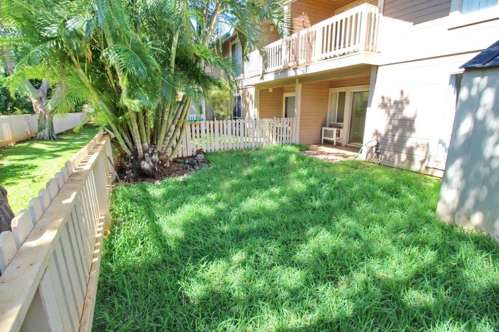 480 Kenolio Road, Unit 15103 Kihei, HI 96753 - Photo 1 of 36 a view of a house with a yard and plants