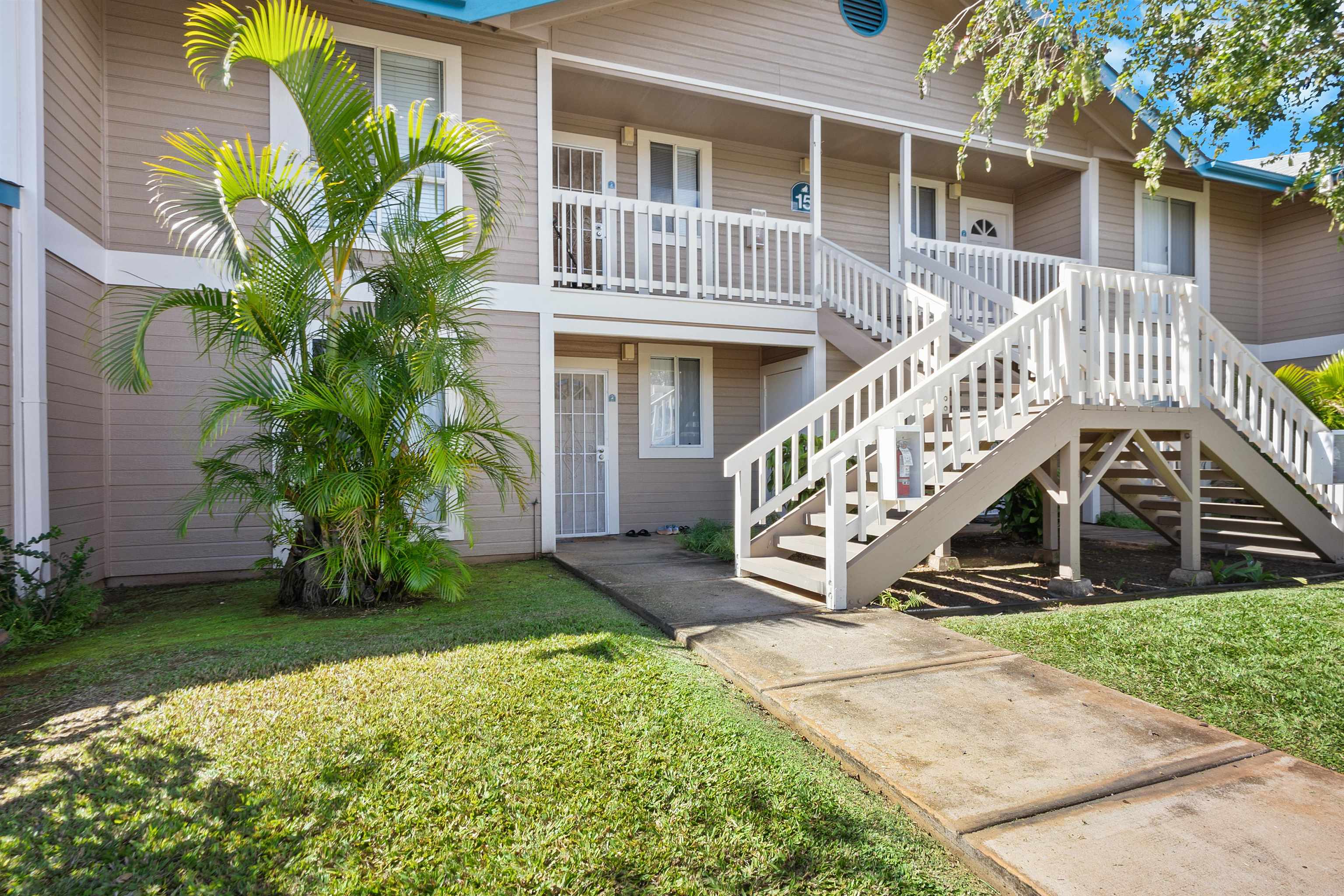 480 Kenolio Road, Unit 15103 Kihei, HI 96753 - Photo 2 of 36 a view of a house with a yard