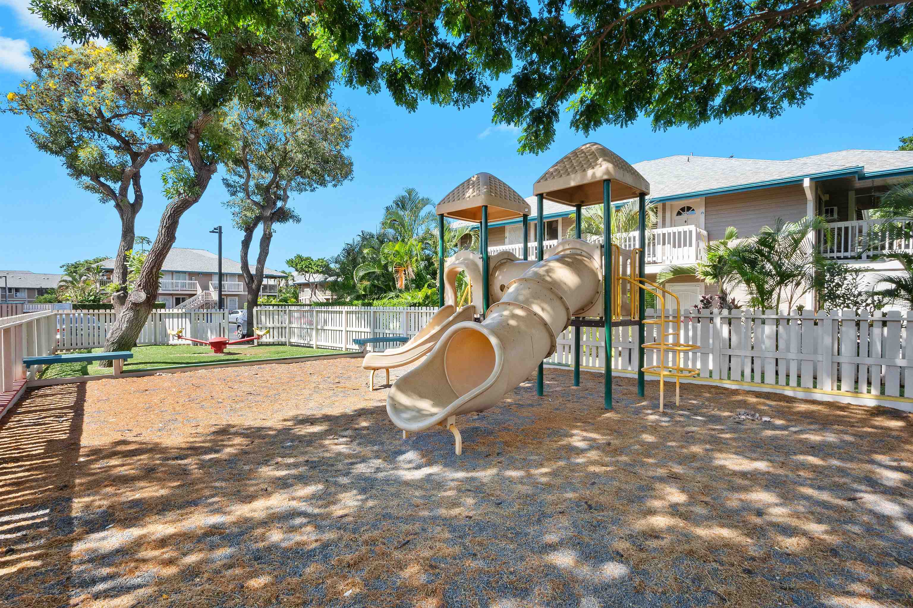480 Kenolio Road, Unit 15103 Kihei, HI 96753 - Photo 26 of 36 a swimming pool with outdoor seating and yard