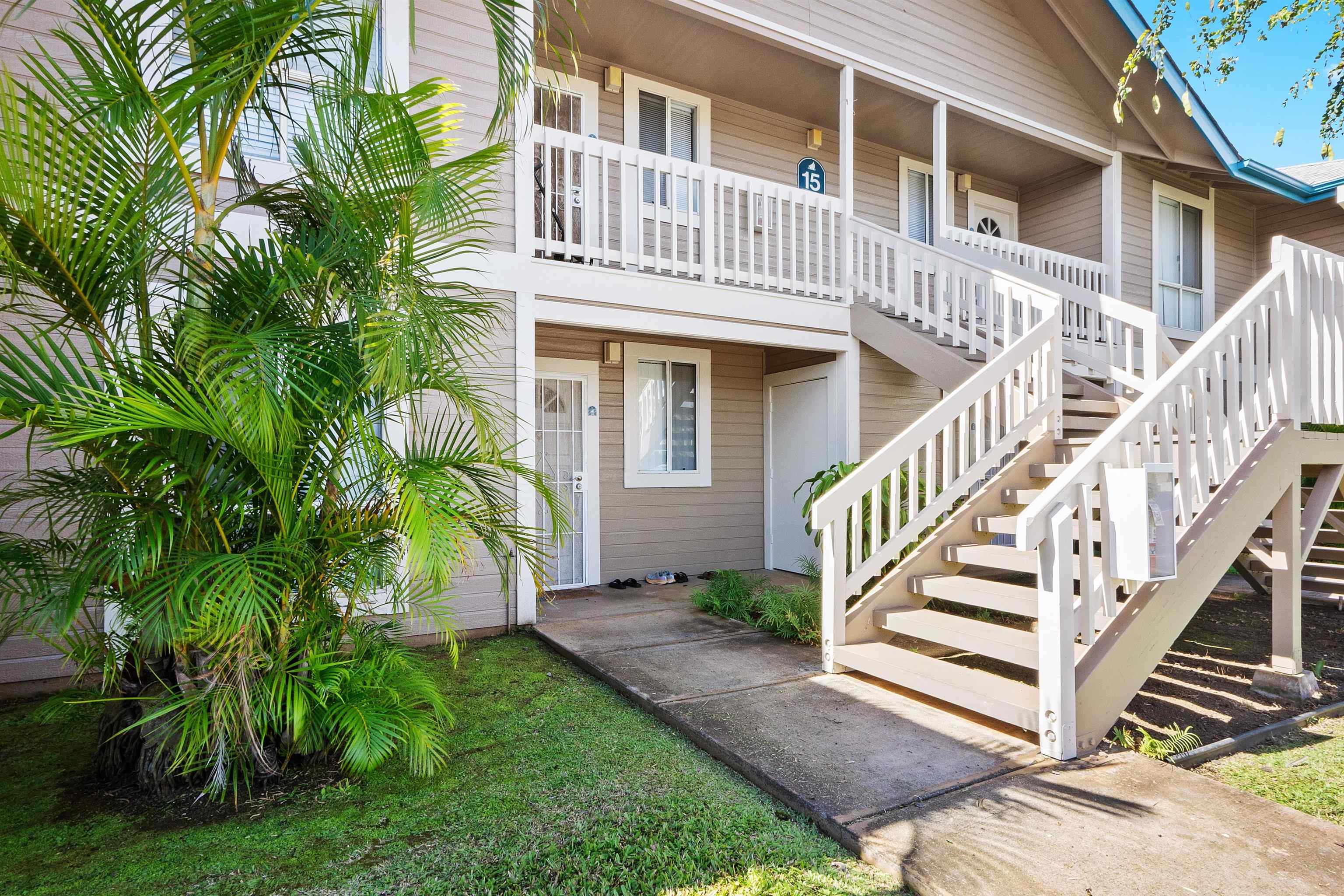 480 Kenolio Road, Unit 15103 Kihei, HI 96753 - Photo 30 of 36 a front view of a house with a yard