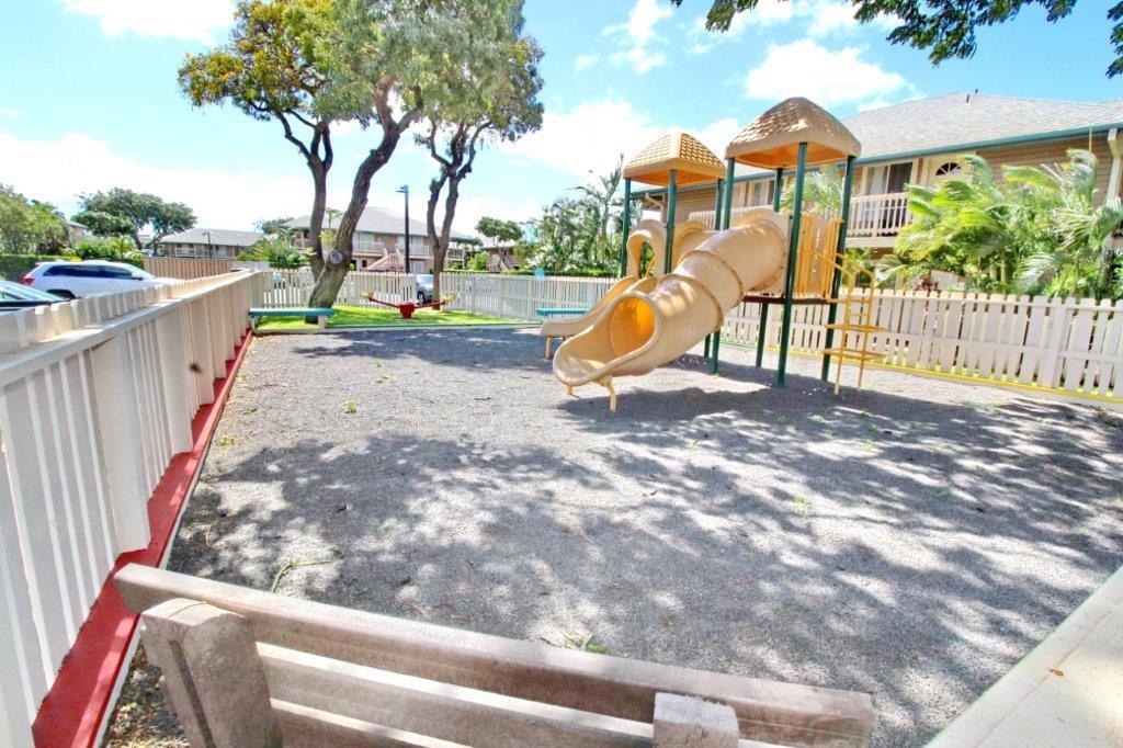480 Kenolio Road, Unit 15103 Kihei, HI 96753 - Photo 33 of 36 a view of outdoor space with garden and deck