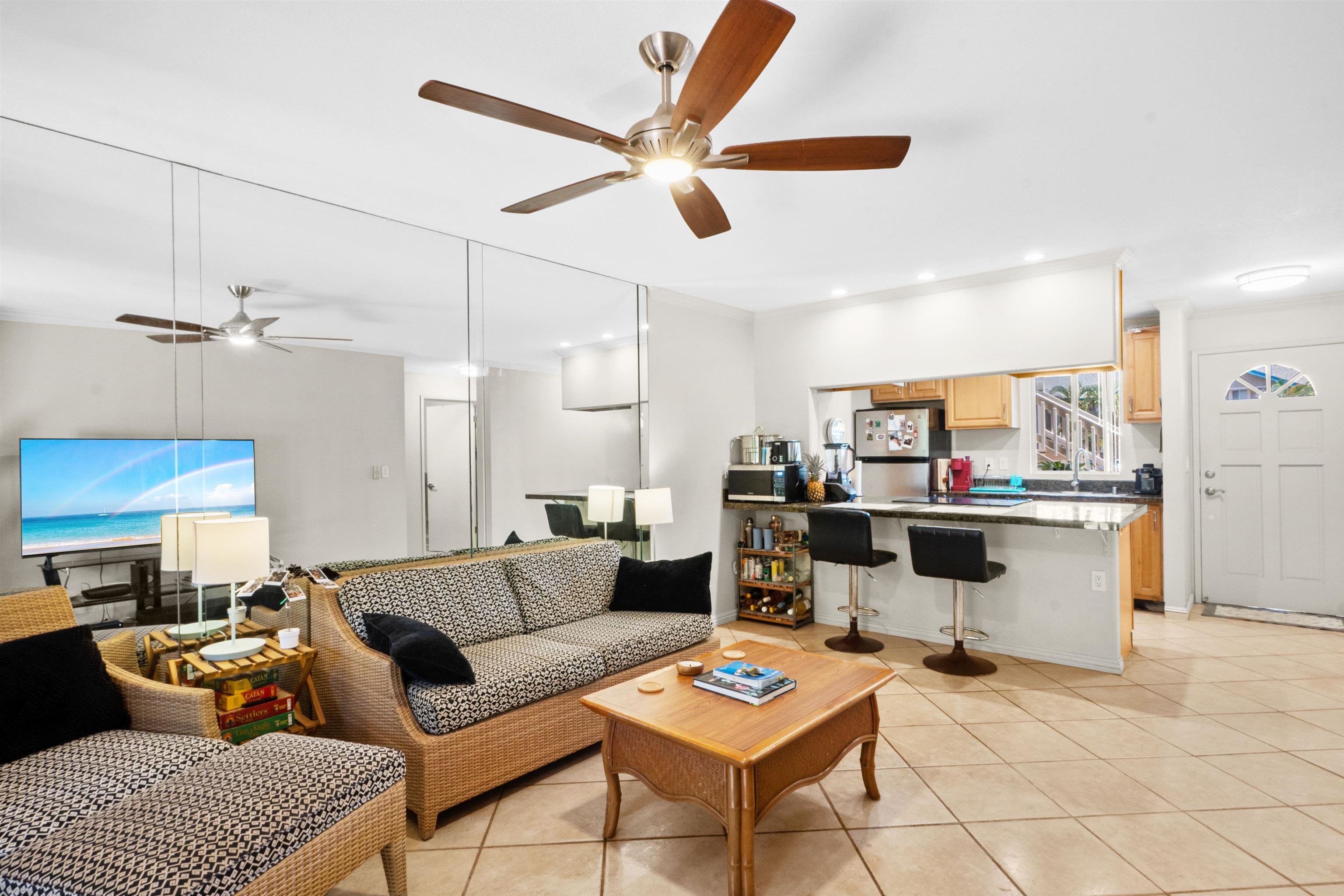 480 Kenolio Road, Unit 15103 Kihei, HI 96753 - Photo 5 of 36 a living room with furniture and kitchen view