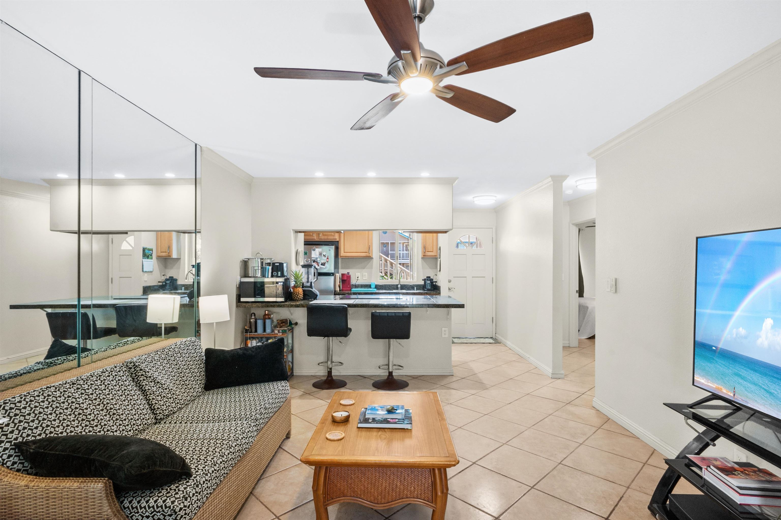 480 Kenolio Road, Unit 15103 Kihei, HI 96753 - Photo 7 of 36 a living room with furniture and kitchen view