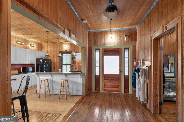 a kitchen with stainless steel appliances granite countertop a sink and cabinets