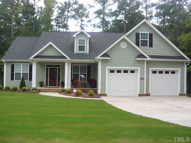 1528 Sedwick Road Durham, NC 27713 - Photo 1 of 18 a front view of a house with a yard and garage
