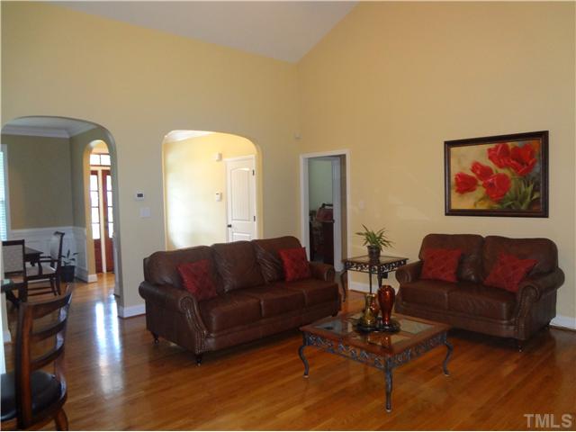 1528 Sedwick Road Durham, NC 27713 - Photo 2 of 18 a living room with furniture a couch and a potted plant