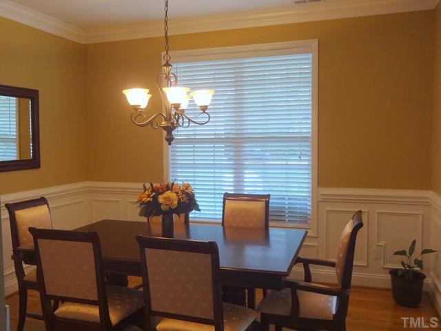 1528 Sedwick Road Durham, NC 27713 - Photo 5 of 18 a dining room with furniture and chandelier