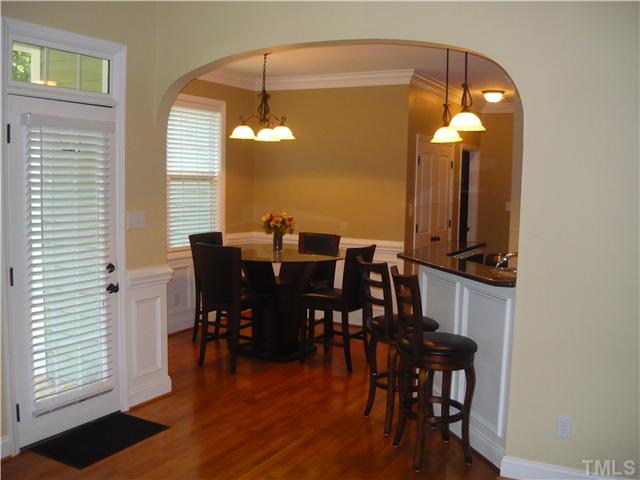 1528 Sedwick Road Durham, NC 27713 - Photo 6 of 18 a view of a dining room with furniture and wooden floor