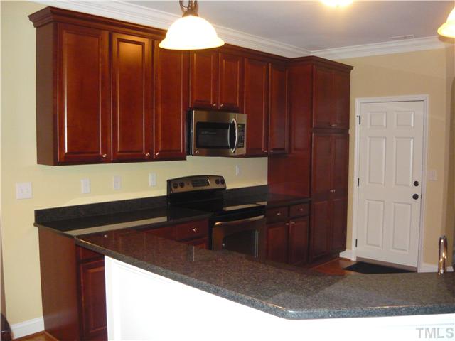1528 Sedwick Road Durham, NC 27713 - Photo 8 of 18 a kitchen with a sink cabinets and appliances