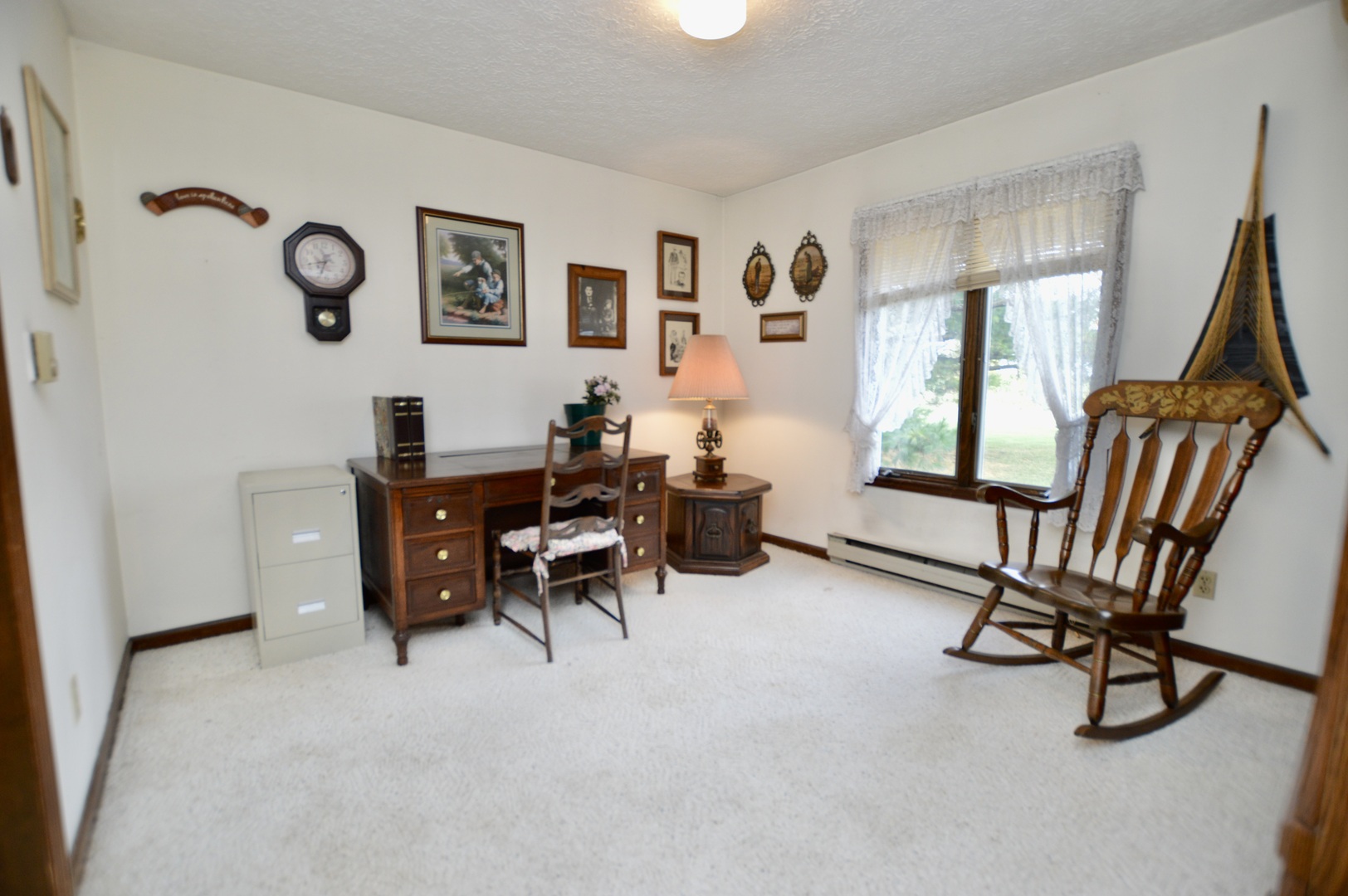 15758 Boone Mc Henry County Line Road Capron, IL 61012 - Photo 17 of 39 a view of a livingroom with furniture and a window