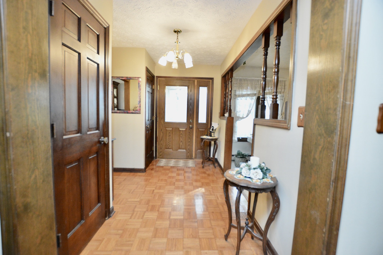 15758 Boone Mc Henry County Line Road Capron, IL 61012 - Photo 28 of 39 a view of a hallway with furniture and chandelier