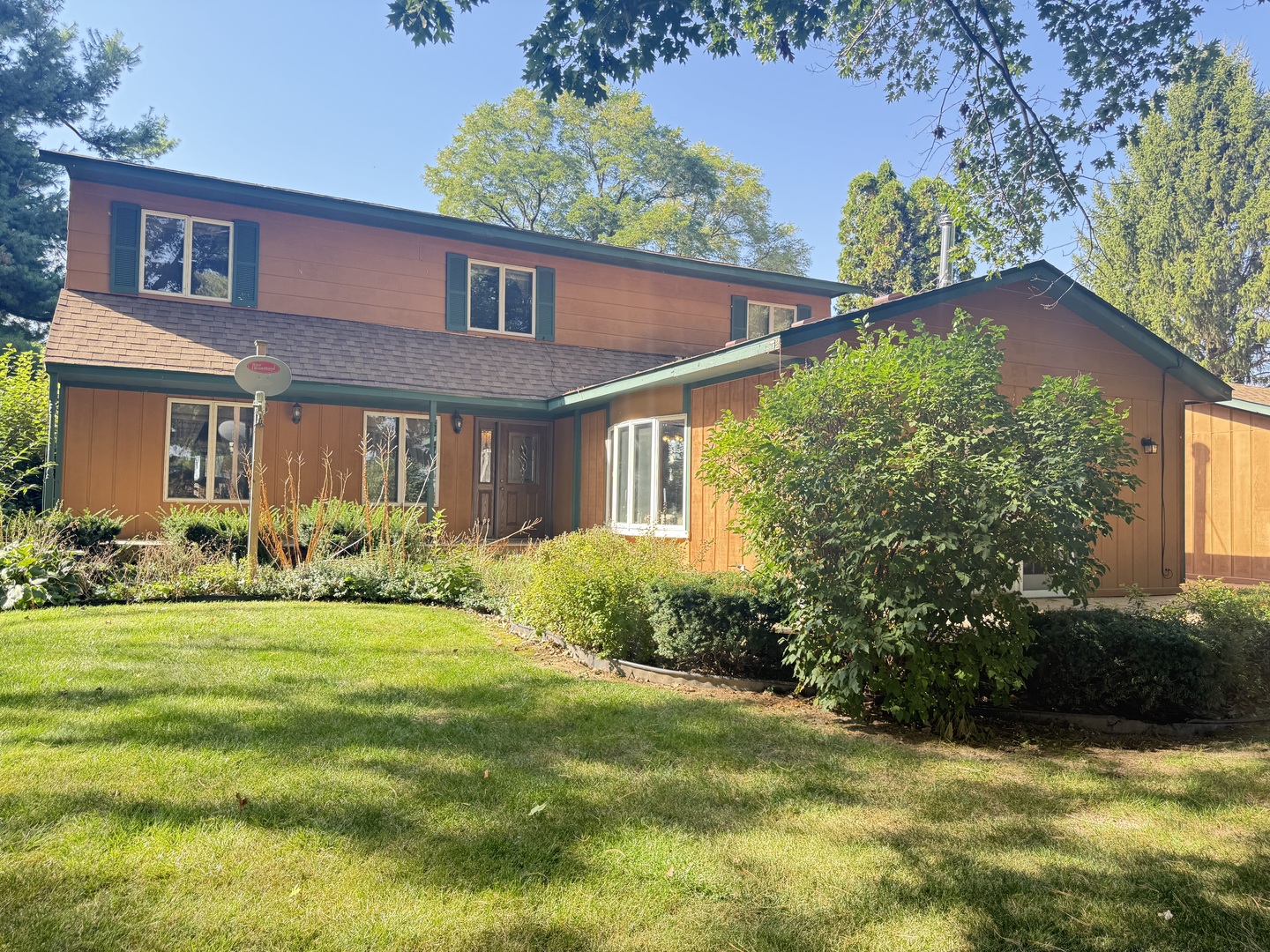 15758 Boone Mc Henry County Line Road Capron, IL 61012 - Photo 39 of 39 a front view of a house with garden