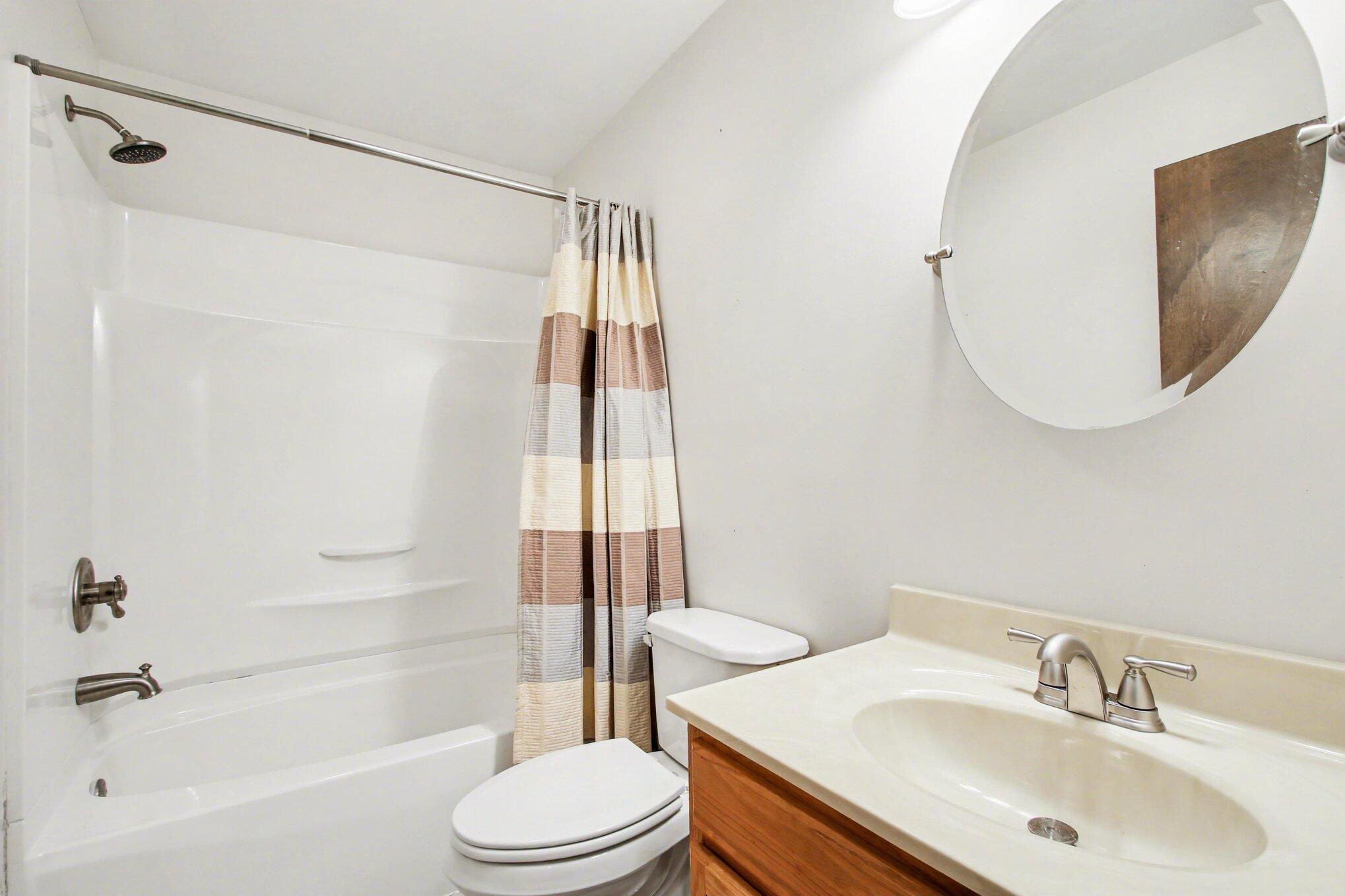 1379 Leeward Road Crown Point, IN 46307 - Photo 21 of 39 a bathroom with a sink toilet and shower