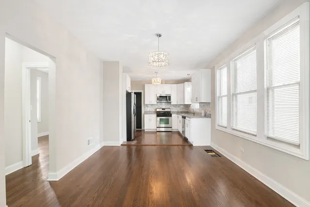 a view of a kitchen with wooden floor