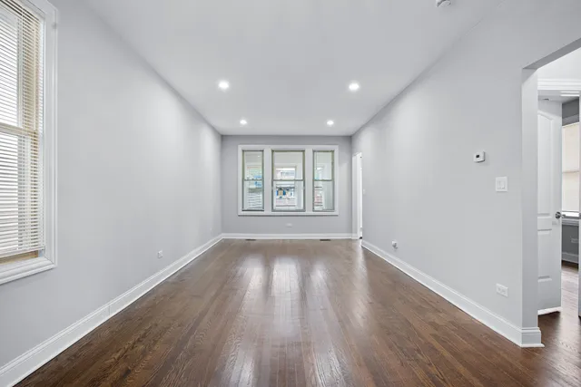 a kitchen with stainless steel appliances granite countertop a refrigerator a stove top oven a sink and dishwasher