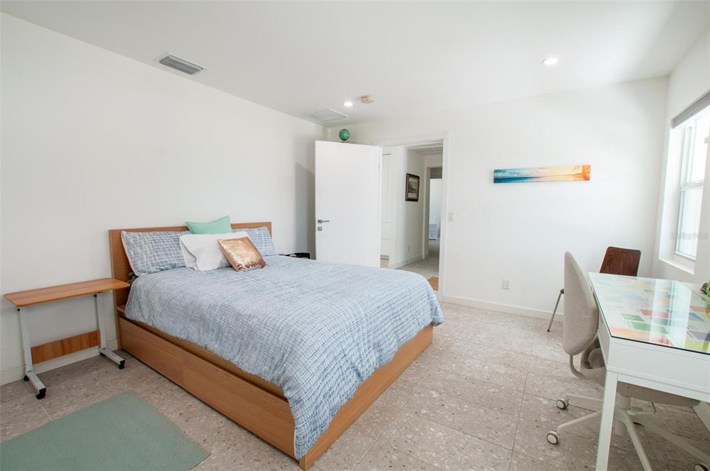 1635 Southwest Rodgers Avenue Arcadia, FL 34266 - Photo 15 of 32 a bedroom with a bed and a table in it