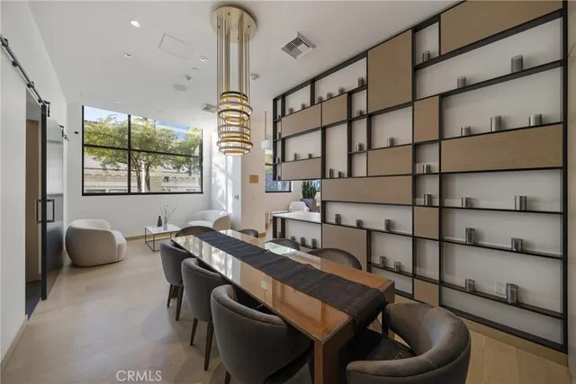 a dining room with furniture and a window