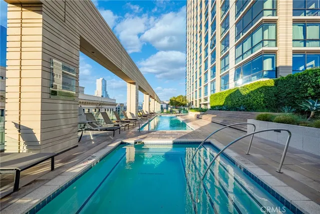 a view of a patio with chairs and wooden floor