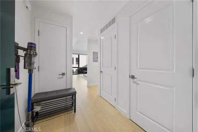 a view of hallway with wooden floor